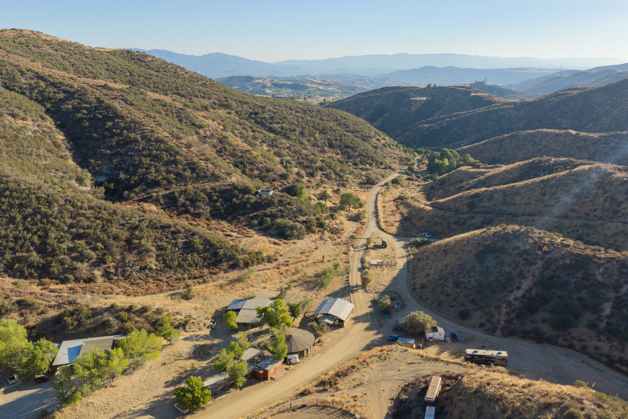 Aerial view of the Angel Trust ranch, buildings, and surrounding hills